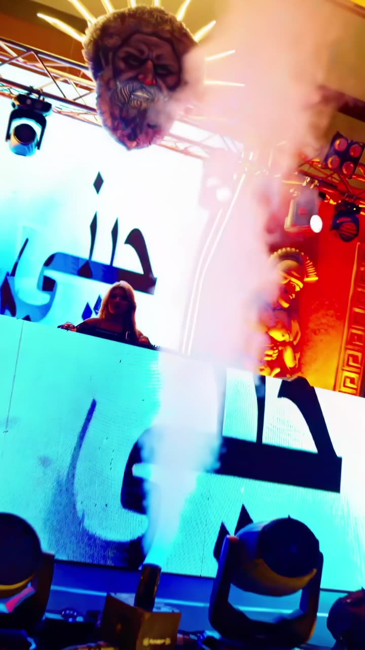 A DJ at the decks under gold stage light, at a night produced by 11:11 at Vivanta Bhubaneswar, DN Square.